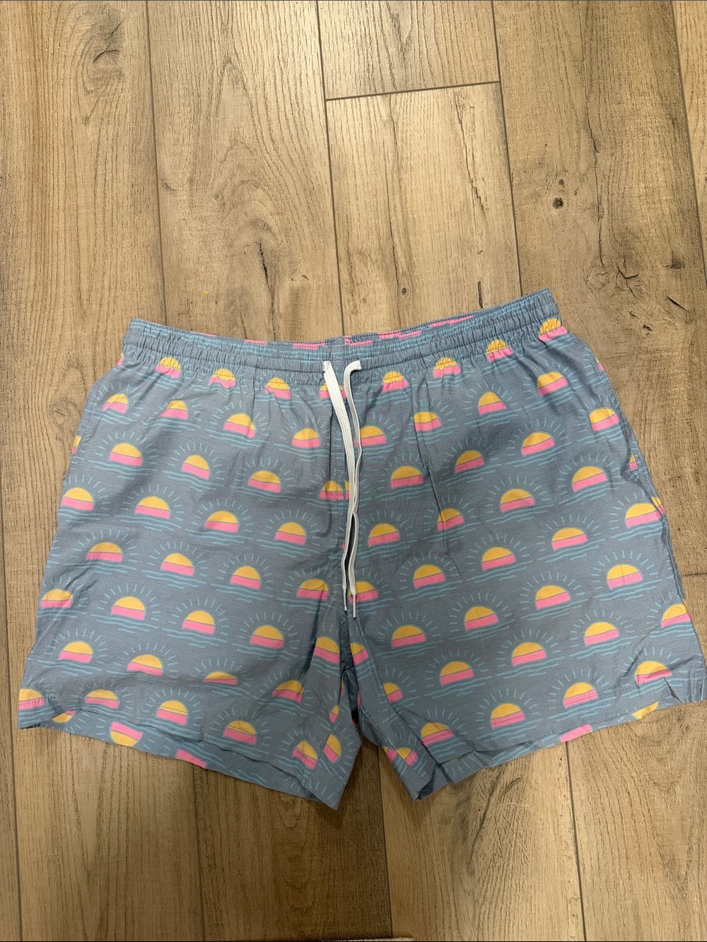 chubbies Blue Swim Trunks with Pink & Yellow Sunrise Pattern